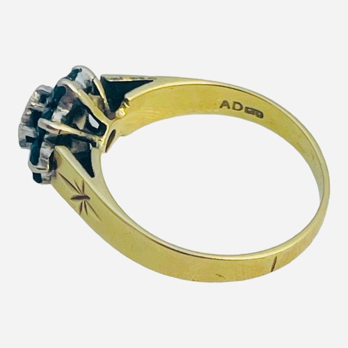 146 - An 18ct yellow gold dress ring, illusion set with a small round diamond to the centre, and eight fac... 