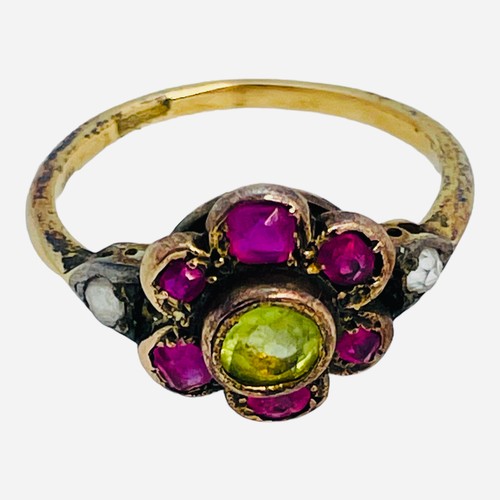 149 - A 15ct gold dress ring, in Suffragette coloured stones, a green faceted centre stone, surrounded by ... 