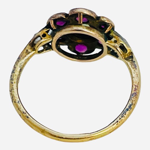 149 - A 15ct gold dress ring, in Suffragette coloured stones, a green faceted centre stone, surrounded by ... 