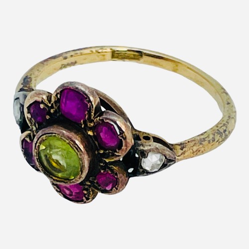 149 - A 15ct gold dress ring, in Suffragette coloured stones, a green faceted centre stone, surrounded by ... 