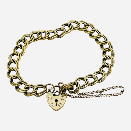 152 - A 9ct yellow gold double link curb bracelet, with heart padlock, weighs 12.1 grams.