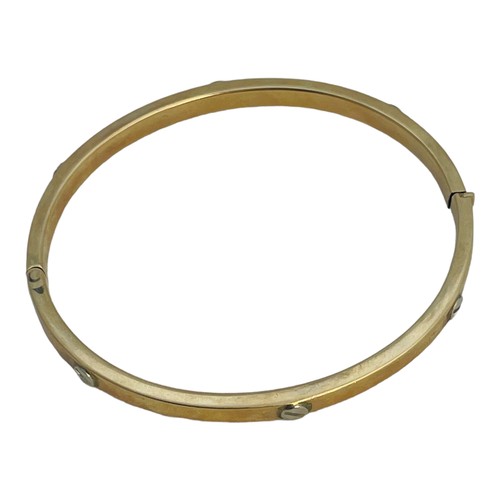 153 - A 9ct gold hinged bangle, with screw top design, weighs 10.4 grams.