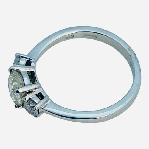 157 - An 18ct white gold ring, set with a central round brilliant cut diamond, estimated weight 1.00cts, w... 