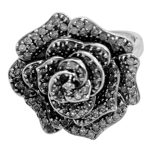 187 - A 9ct white gold dress ring, set with small round diamonds, estimated 0.50cts, in a full bloom flora... 