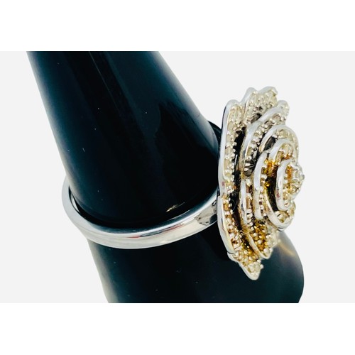 187 - A 9ct white gold dress ring, set with small round diamonds, estimated 0.50cts, in a full bloom flora... 