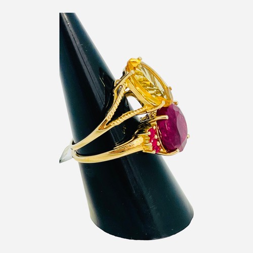 188 - A 9ct yellow gold dress ring, set with a round faceted garnet, with 3 x small garnets set to each sh... 