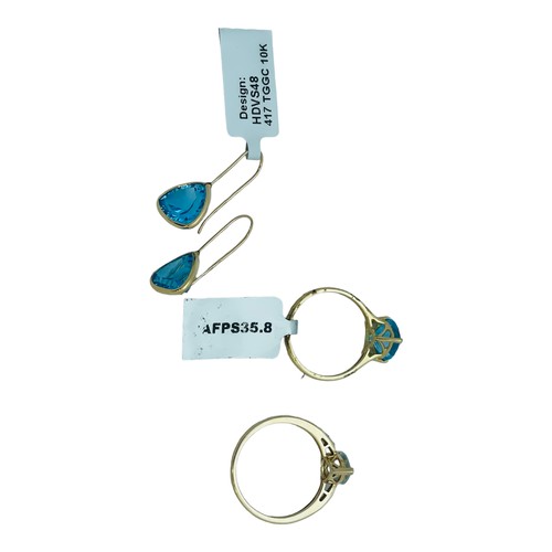 183 - A 9ct yellow gold dress ring, claw set with a blue faceted stone, and matching earrings, together wi... 