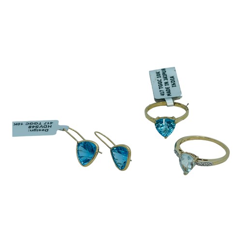 183 - A 9ct yellow gold dress ring, claw set with a blue faceted stone, and matching earrings, together wi... 