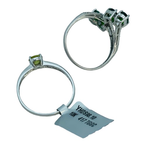 186 - Two 9ct white gold dress rings, set with green and white stones, total weight 5.0 grams.