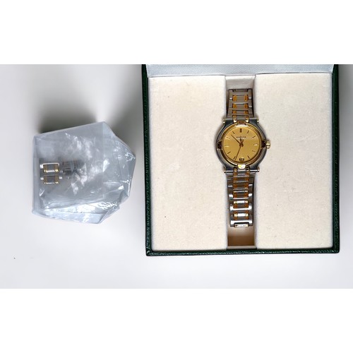 103 - A ladies Gucci 9000L bi-colour stainless steel wristwatch, the gold dial with gold batons denoting h... 