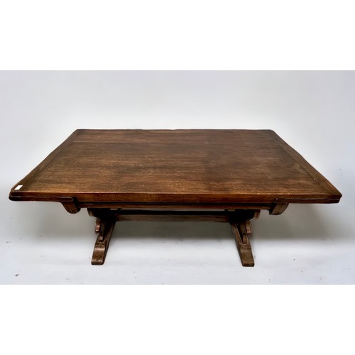 531 - A Bevan Funnell Ltd 'Reprodux' oak draw-leaf extending trestle dining table with pierced shaped tres... 