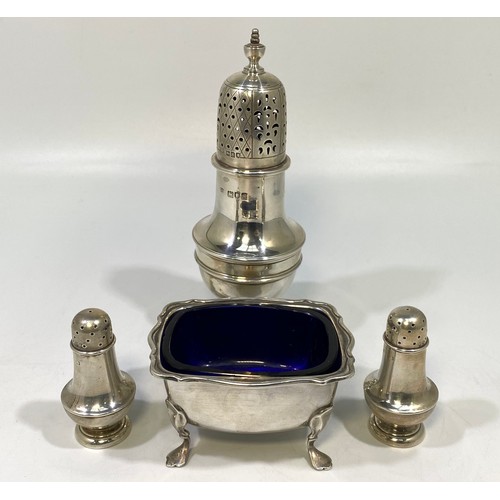 64 - A pair of Victorian silver baluster-shaped peppers, London, 1887, and silver baluster sugar caster, ... 