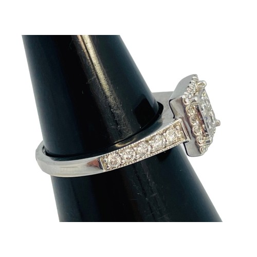 203 - An 18ct white gold diamond ring, set with 4 x princess cut diamonds to the centre, with small round ... 