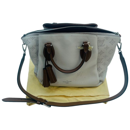 270 - A Louis Vuitton Haumea handbag, brown and grey leather, silver hardware, crossbody brown strap, L39 ... 