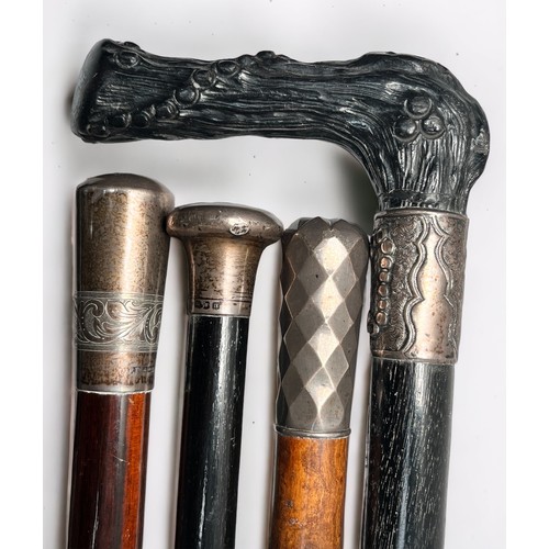 294 - Fifteen various silver-topped nd white-metal topped walking canes comprising, an Ebony walking cane ... 