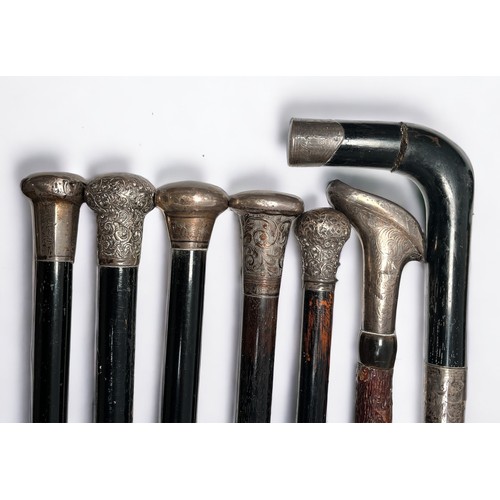 294 - Fifteen various silver-topped nd white-metal topped walking canes comprising, an Ebony walking cane ... 