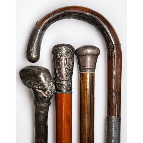 294 - Fifteen various silver-topped nd white-metal topped walking canes comprising, an Ebony walking cane ... 