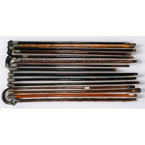 294 - Fifteen various silver-topped nd white-metal topped walking canes comprising, an Ebony walking cane ... 