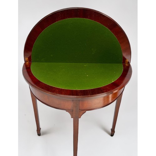 542 - An Edwardian mahogany dem-lune folding card table, with green baize playing surface, and rear slidin... 