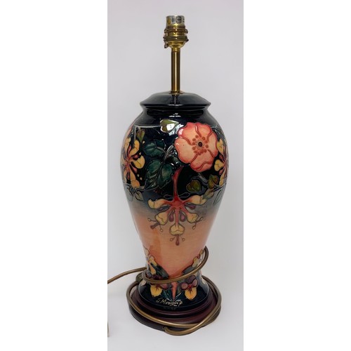 33 - A Moorcroft pottery table lamp of inverted baluster form and decorated in the Hibiscus Moon pattern,... 