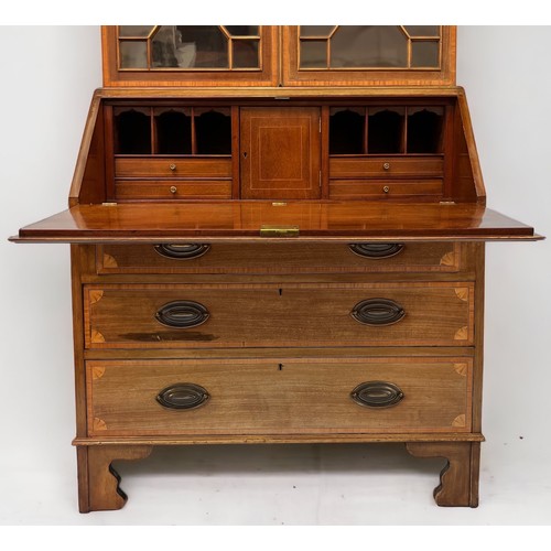 539 - An Edwardian mahogany and satinwood cross-banded bureau bookcase in the Sheraton Revival style, with... 