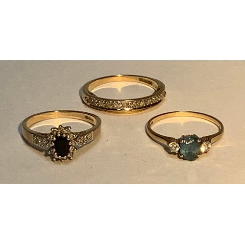 236 - Three various 9ct gold rings, set with gemstones and diamonds, one with a hinged secondary band read... 