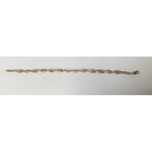 231 - An 18ct gold bi-colour bracelet, of twisted design, 19.8cm long, gross weight approximately 5.5g