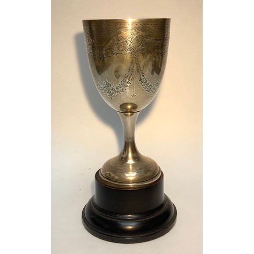 82 - A silver trophy cup/goblet by Joseph Gloster Ltd, with scrolled and foliate engraved decoration, hal... 