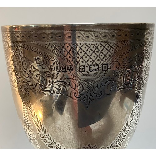 82 - A silver trophy cup/goblet by Joseph Gloster Ltd, with scrolled and foliate engraved decoration, hal... 