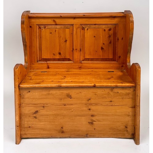 548 - A pine pew with raised panel back, shaped arms and hinged seat enclosing storage space, 93cm, togeth... 