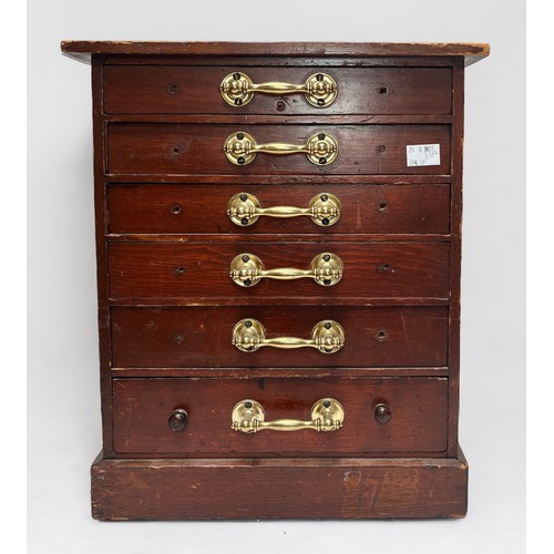 315 - A stained wooden specimen cabinet, with six drawers, each with brass pulls enclosing compartmented i... 