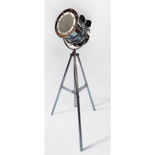 409 - An adjustable chrome searchlight/standard lamp, with barrel light fitting and frosted glass front, r... 