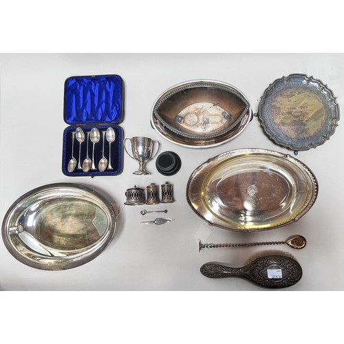 83 - A small collection of assorted silver comprising a small trophy, a trowel bookmark, a three piece cr... 