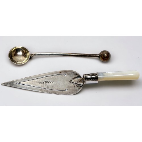 83 - A small collection of assorted silver comprising a small trophy, a trowel bookmark, a three piece cr... 