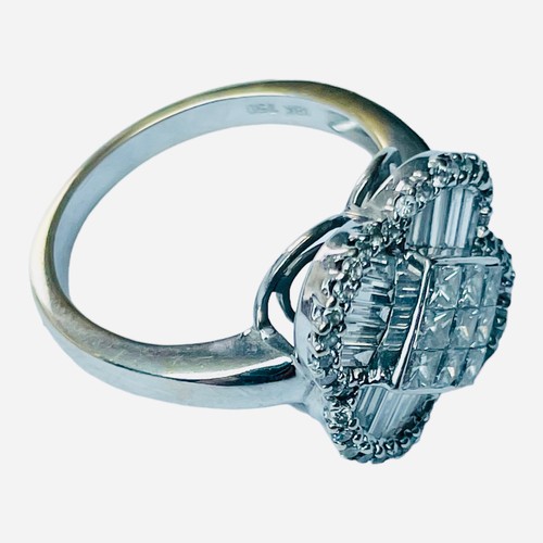 244 - An 18ct white gold dress ring, set with 9 x princess cut diamonds to the centre, in an invisible set... 