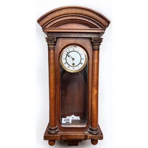 400 - A walnut and beech cased Vienna wall clock with white enamel dial and pendulum, arched moulded friez... 