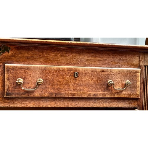 537 - An 18th century oak Mule Chest, the hinged top enclosing a shallow compartment, the front with a pai... 