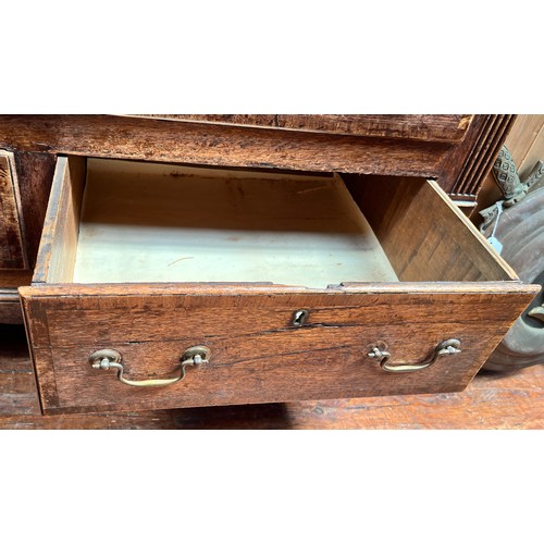 537 - An 18th century oak Mule Chest, the hinged top enclosing a shallow compartment, the front with a pai... 