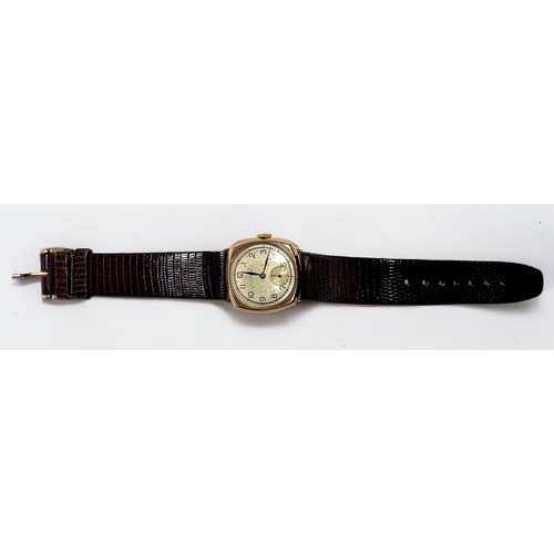 127 - A vintage 9ct gold cushion cased wristwatch, C.1947, the gilt dial with Arabic numerals denoting hou... 