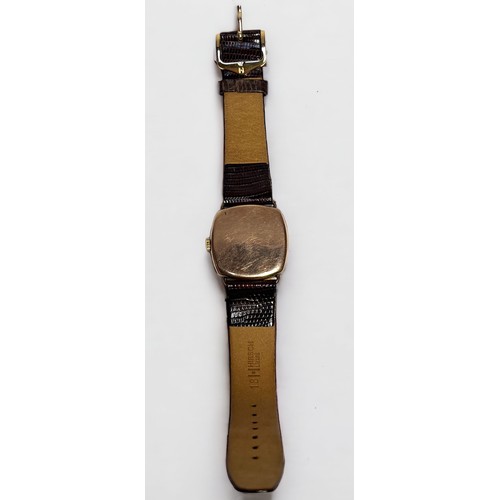 127 - A vintage 9ct gold cushion cased wristwatch, C.1947, the gilt dial with Arabic numerals denoting hou... 