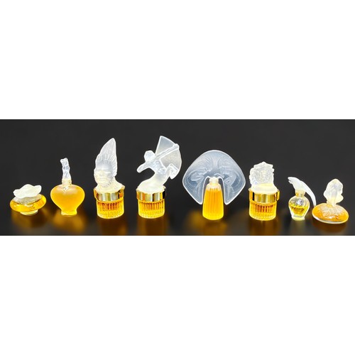 14 - Twenty-two small perfume bottles including seven Lalique perfume bottles with contents, together wit... 