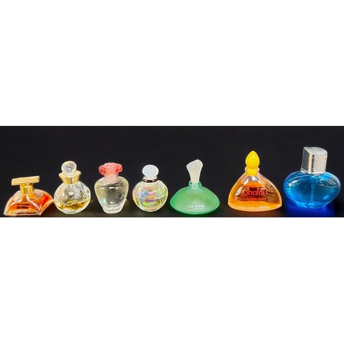 14 - Twenty-two small perfume bottles including seven Lalique perfume bottles with contents, together wit... 