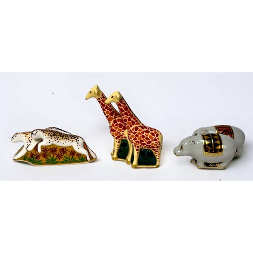 9 - A Royal Crown Derby paperweight set of Noah’s Ark, with seven pairs of animals, and a dove.