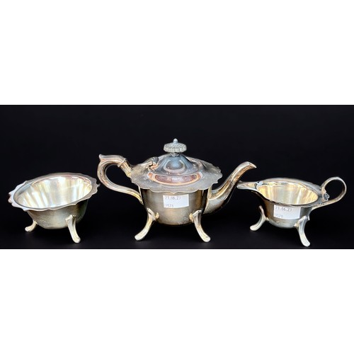 94 - A three-piece silver-plated teaset, a pair of silver-plated grape scissors, oval galleried two-handl... 