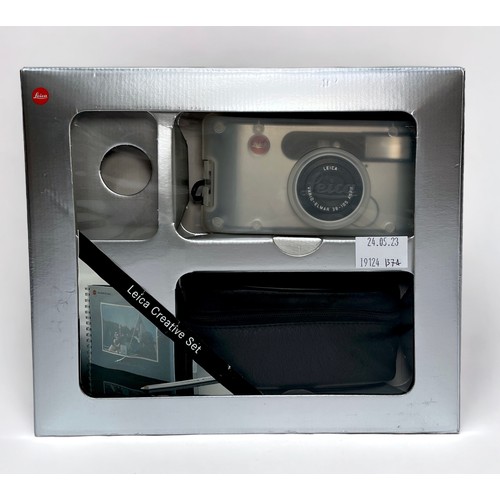 391 - A boxed Leica ‘Creative Set’, comprising, a Leica C1 compact camera, black leather carry case, a sma... 