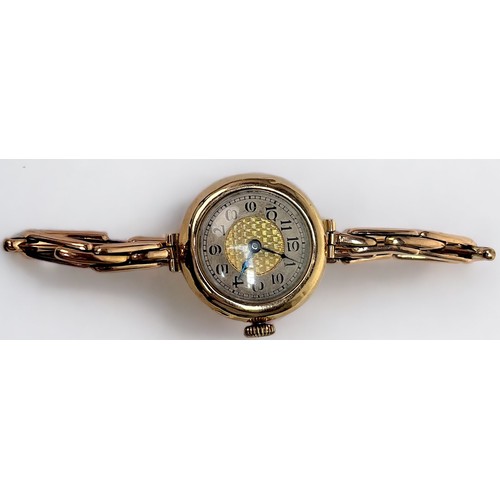 144 - A vintage ladies 9ct gold wristwatch, the silvered chapter ring with Arabic numerals denoting hours,... 