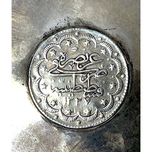 109 - An early 20th century Indian silver (tests as .800 or above) parasol handle, masked hybrid creatures... 