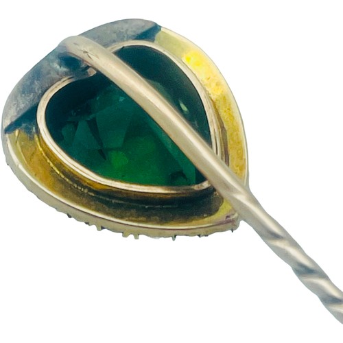 170 - A 15ct gold and 9ct gold stick pin, set with a heart shaped faceted green stone, surrounded by seed ... 