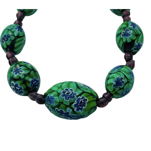 186 - An Art Deco style Venetian glass bead necklace, graduated, measuring approximately 28 inches.