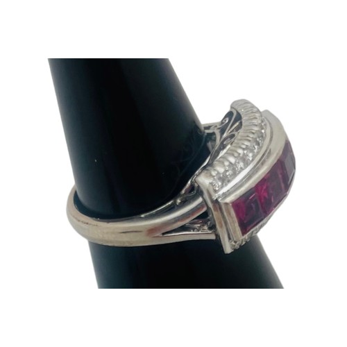 199 - An 18ct white gold dress ring, invisible set with 5 x princess cut rubies to the centre, each ruby w... 